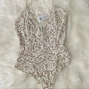 Nude and white lace bodysuit